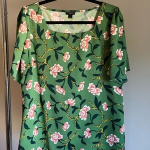 Green, gold, and coral floral blouse with flutter sleeves